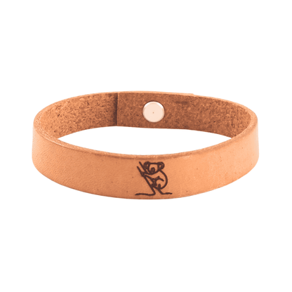 A brown leather bracelet with a koala engraved on it.