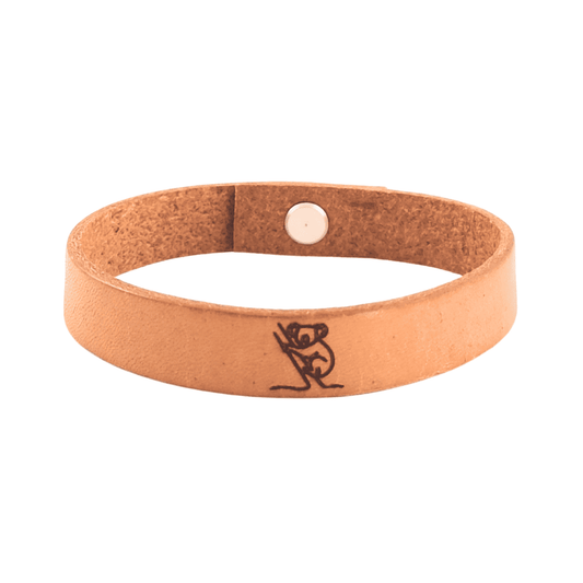 A brown leather bracelet with a koala engraved on it.