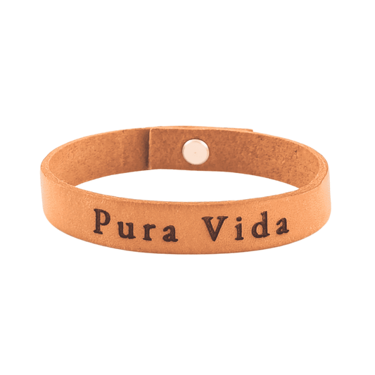 A brown leather bracelet with 'Pura Vida' engraved on it.