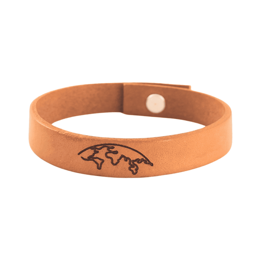 A brown leather bracelet with the world engraved on it.
